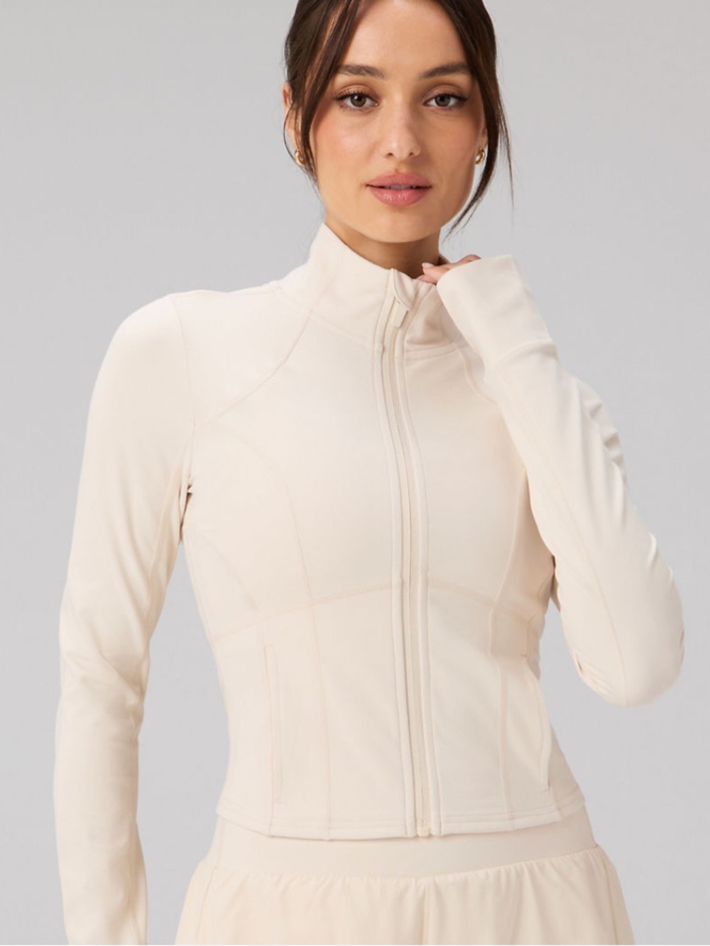 Fabletics Perfect Storm Cropped Train Jacket in almond milk